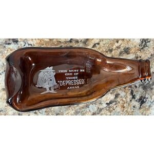 Flattened Glass Bottle Astray "Must Be One of Those Depressed Areas" Novelty